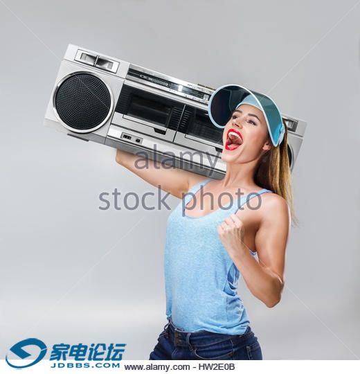 young-happy-sport-style-fashion-woman-listening-music-with-boombox-hw2e0b.jpg